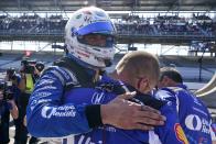 Graham Rahal hugs a crew member after Rahal was bumped from the Indianapolis 500 auto race at Indianapolis Motor Speedway, Sunday, May 21, 2023, in Indianapolis. (AP Photo/Darron Cummings)