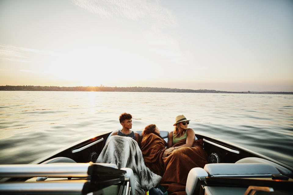 parents with a child on a boat