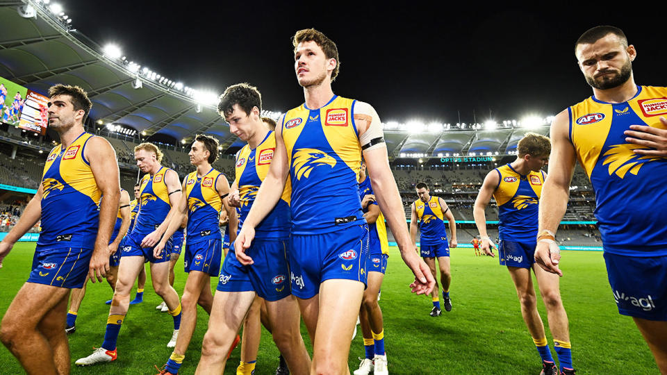 Seen here, West Coast players leave the field after their round one loss against Gold Coast.