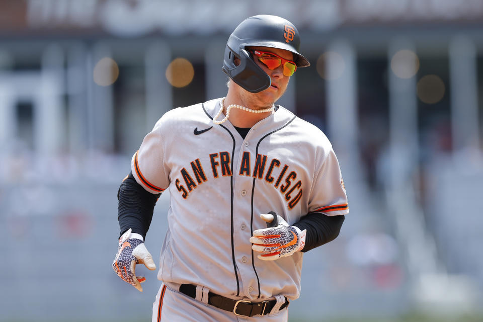 San Francisco Giants' Joc Pederson rounds third after hitting a home run in the ninth inning of a baseball game against the Atlanta Braves, Thursday, June 23, 2022, in Atlanta. (AP Photo/Todd Kirkland)