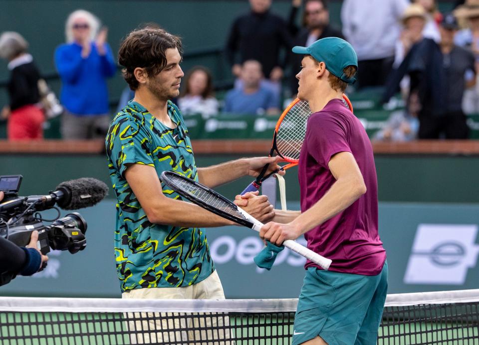 Taylor Fritz of the United States (left) shakes hands with Jannik Sinner of Italy after Sinner wins their quarterfinal match at the BNP Paribas Open at the Indian Wells Tennis Garden in Indian Wells, Calif., Thursday, March 16, 2023. 