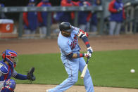 Minnesota Twins' Nelson Cruz strikes out against the Texas Rangers during the first inning of a baseball game Wednesday, May 5, 2021, in Minneapolis. (AP Photo/Stacy Bengs)