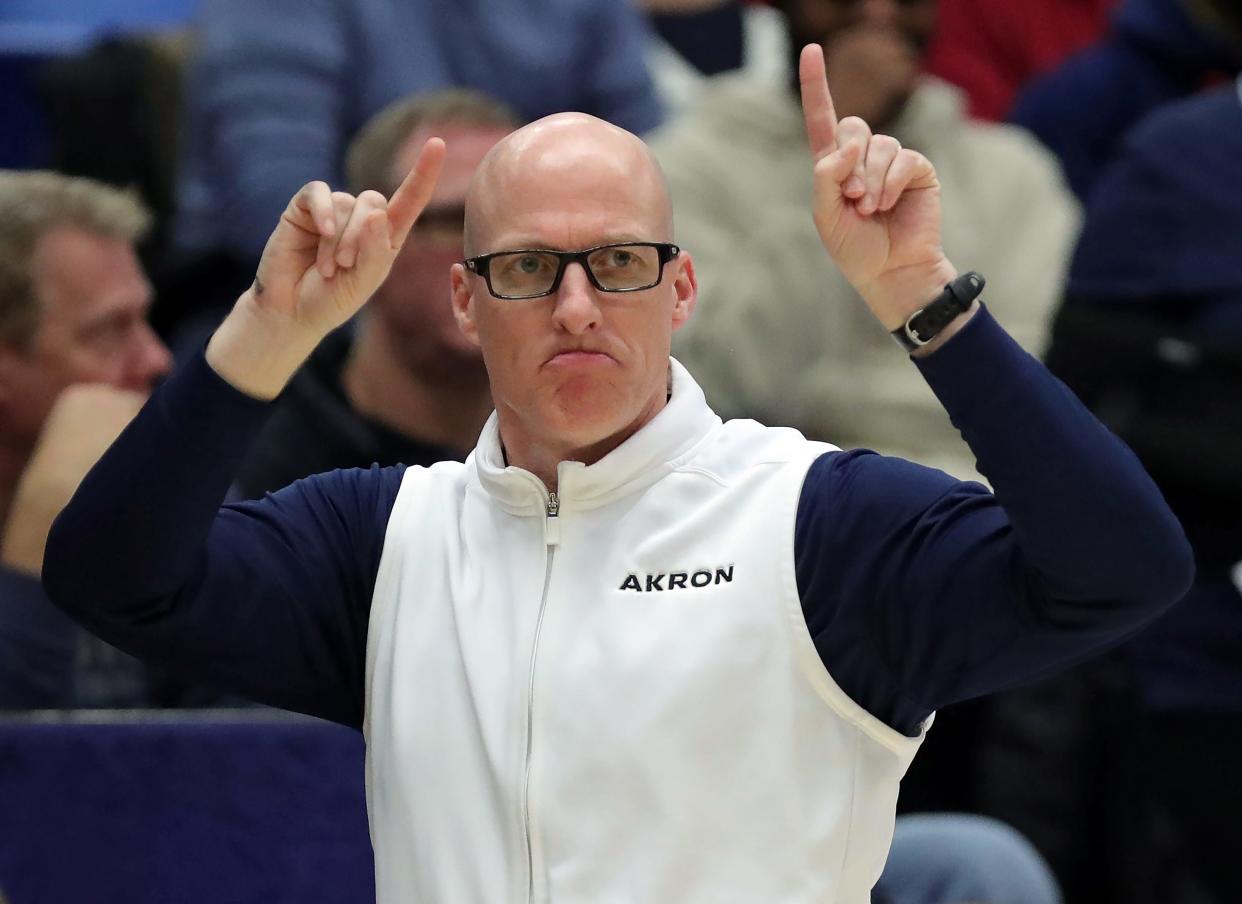 Akron Zips head coach John Groce signals to his team in the second half, Friday, Jan. 5, 2024.