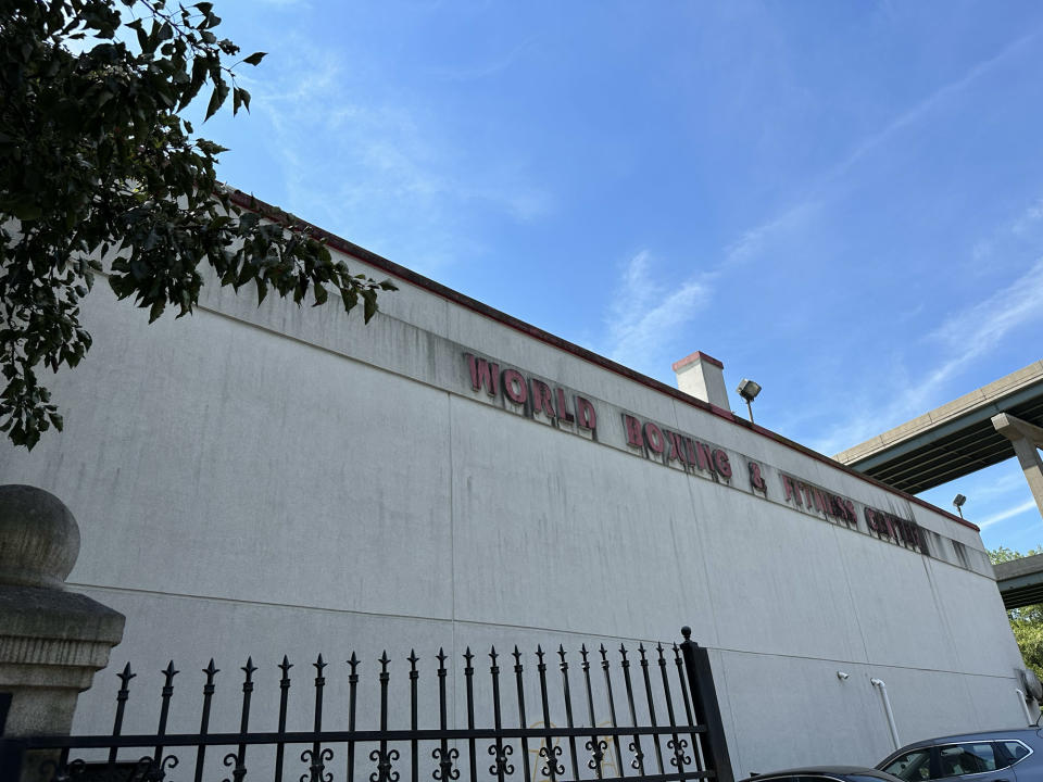 <p>A photo from the iPhone 14 Pro's main camera featuring an aging sign for a gym against a blue sky.</p>
