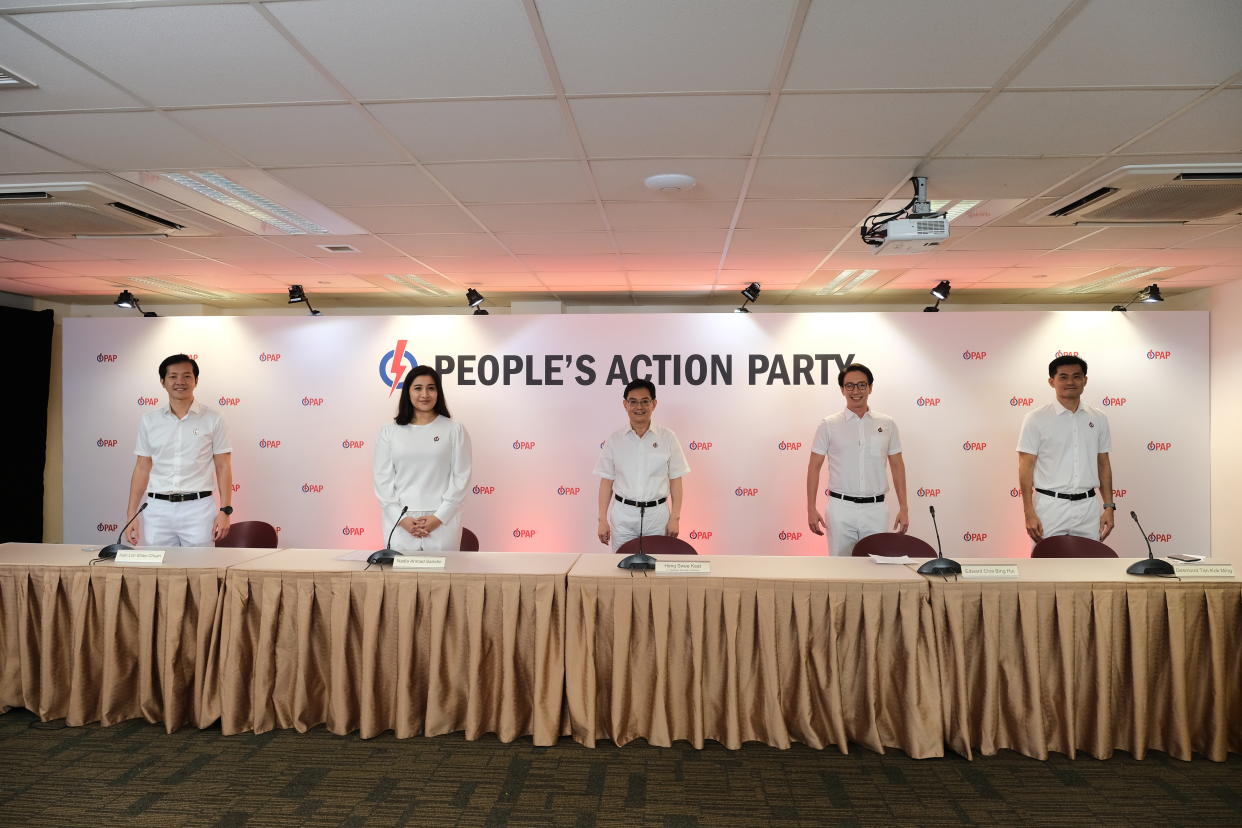People's Action Party first assistant secretary-general Heng Swee Keat (centre) with the party's new candidates for the GE (from left) Ivan Lim, Nadia Samdin, Edward Chia and Desmond Tan. (Photo: PAP HQ)
