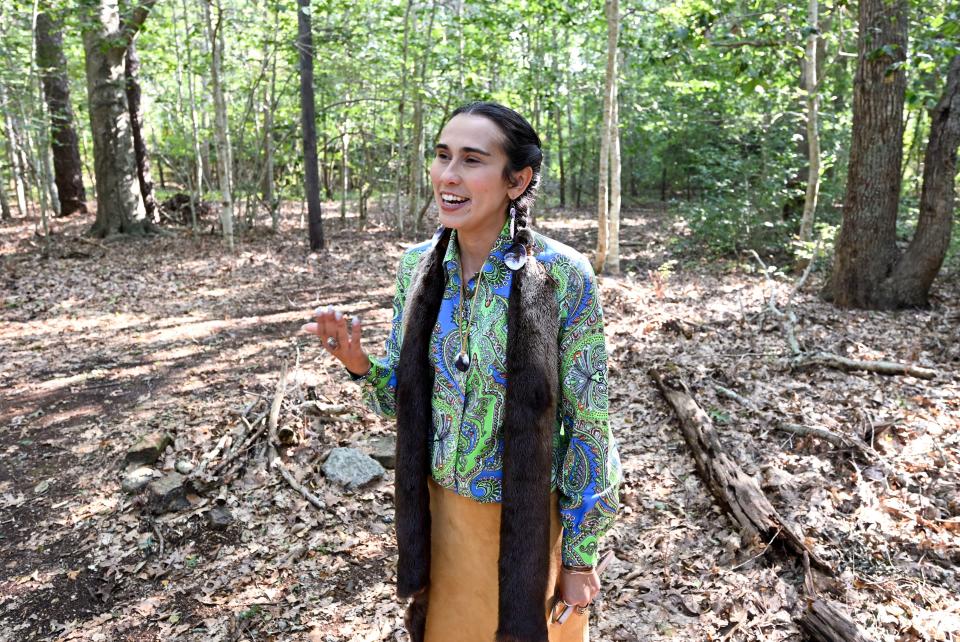Mashpee Wampanoag Tribe member Talia Landry stands at on the 12 acres that she and other tribe members want restored to tribal jurisdiction at the Oct. 28 annual town meeting. Landry is a lead petitioner for the town meeting article.