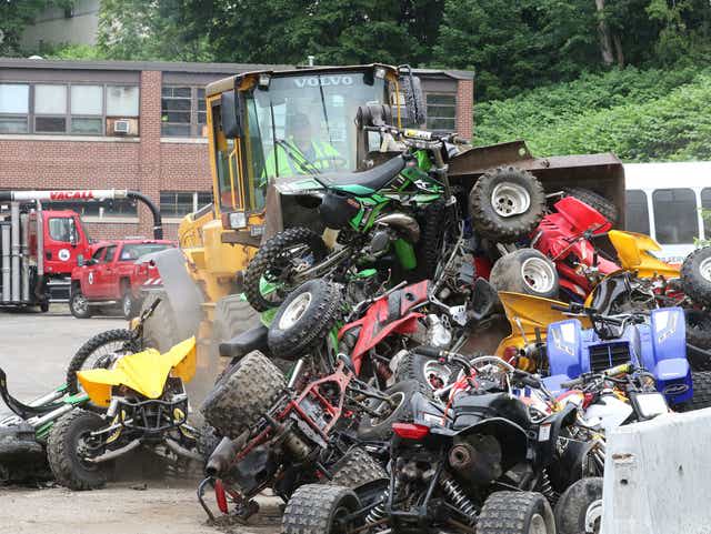 In Providence, seized illegal off street vehicles are destroyed.