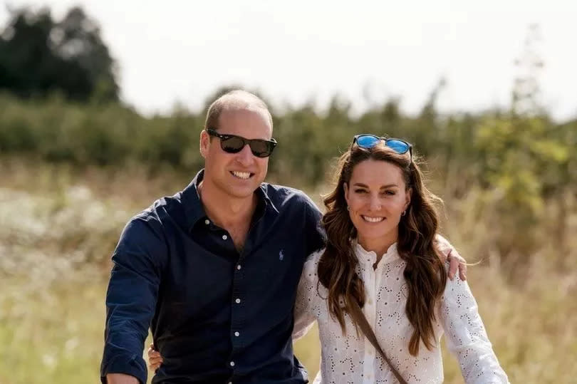 Prince William and Princess Kate riding bicycles