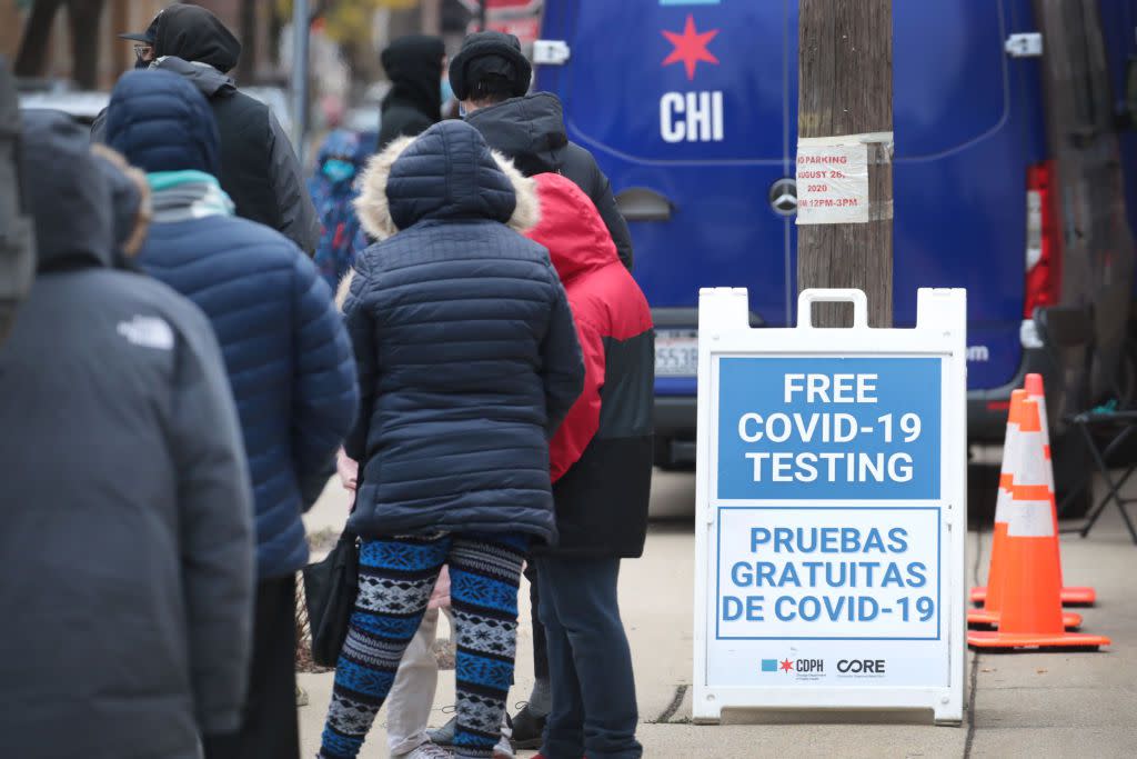 Residents line up for COVID-19 testing at Pritzker College Prep high school in the Hermosa neighborhood in Chicago.