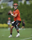 Cincinnati Bengals' Joe Burrow looks to pass during an NFL football practice in Cincinnati, Wednesday, July 28, 2021. (AP Photo/Aaron Doster)