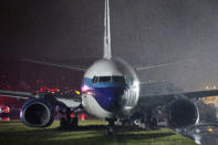 A campaign plane that had been carrying U.S. Republican vice presidential nominee Mike Pence rests in the grass after it skidded off the runway while landing in the rain at LaGuardia Airport in New York, U.S.,October 27, 2016. REUTERS/Lucas Jackson