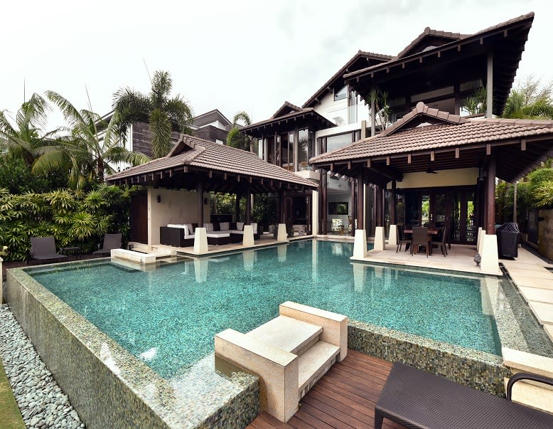 This Balinese-style house with pavilions on Ocean Drive was designed by Timur Designs