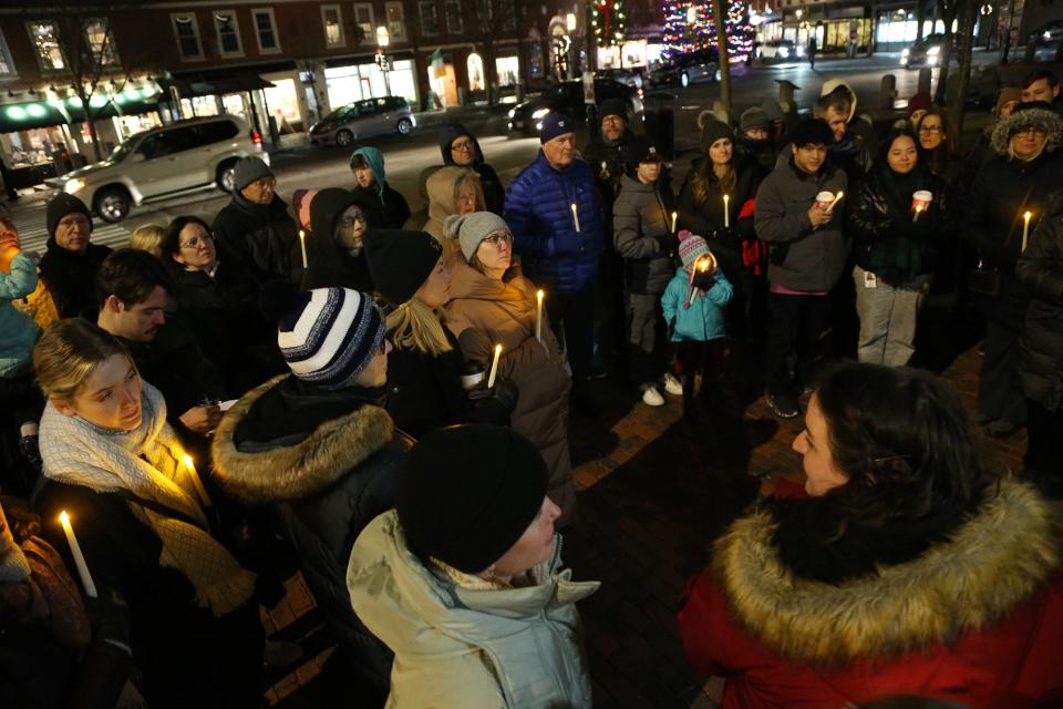 Cross Roads House staff organizes the Homeless Persons' Memorial Day vigil in downtown Portsmouth Thursday, Dec. 21, 2023.