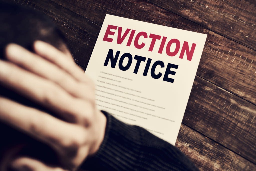 An eviction notice on a wooden table