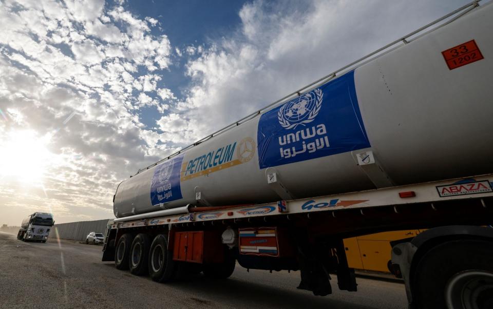 Trucks at the Egyptian side of the Rafah border crossing with Gaza