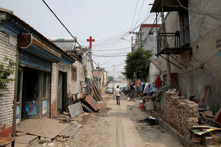 A general view of a street in Xiaozhangwan village of Tongzhou district, on the outskirts of Beijing, China June 28, 2017. Picture taken June 28, 2017. REUTERS/Jason Lee