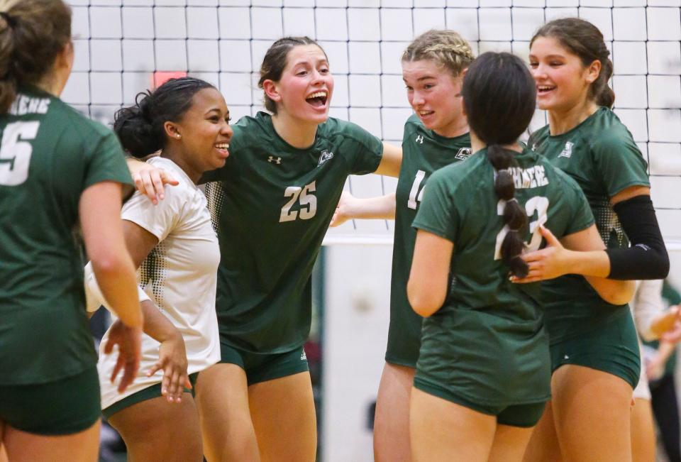 Archmere's (from left) Katherine Kuehl, Autumn Richardson-Peters, Cecilia Connolly, Bridget Malloy, Abigail Im and Ava Beach come together after a point in the third set of the Auks' five-set win in the opening round of the DIAA state high school tournament, Thursday, Nov. 2, 2023 at Archmere Academy.