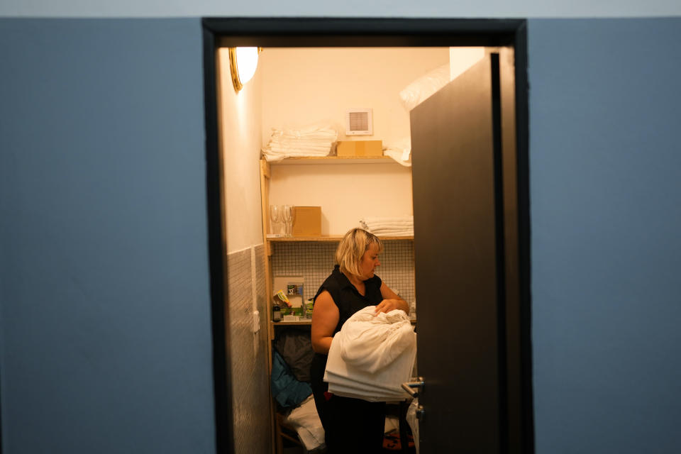 Ukrainian refugee Liudmyla Chudyjovych prepares to make up a room in a hotel where she works, Wednesday, Aug. 3, 2022, in Prague, Czech Republic. Nearly six months after the Russian invasion of Ukraine, many refugees are still struggling to find jobs in their European Union host countries, despite the EU's streamlined process for Ukrainians to live and work in any of its 27 member nations. (AP Photo/Petr David Josek)