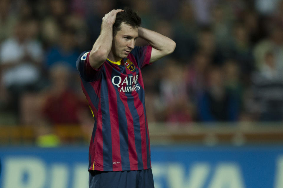 Barcelona's Lionel Messi from Argentina gestures against Granada's during a Spanish La Liga soccer match between FC Granada and FC Barcelona at Los Carmenes stadium in Granada, Spain, Saturday, April 12, 2014. (AP Photo/Daniel Tejedor)