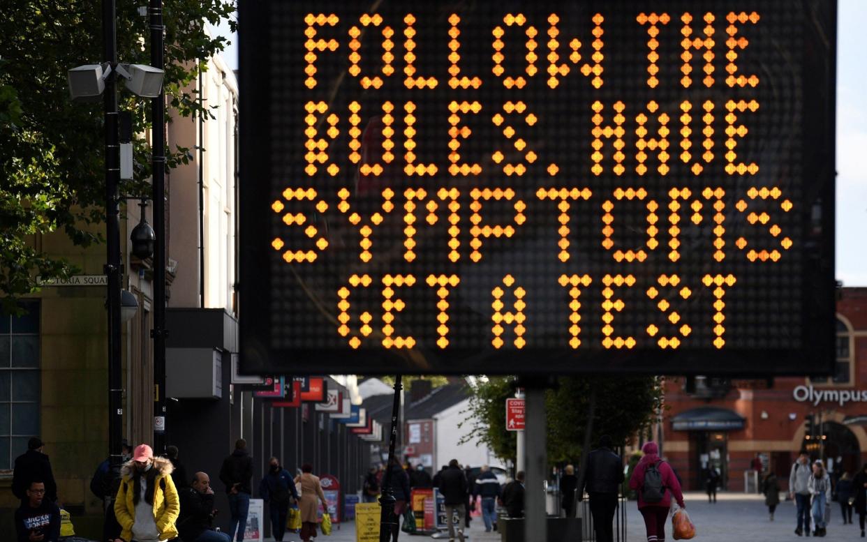 Coronavirus symptoms sign, Bolton, 2020 - Oli Scarff/AFP via Getty Images