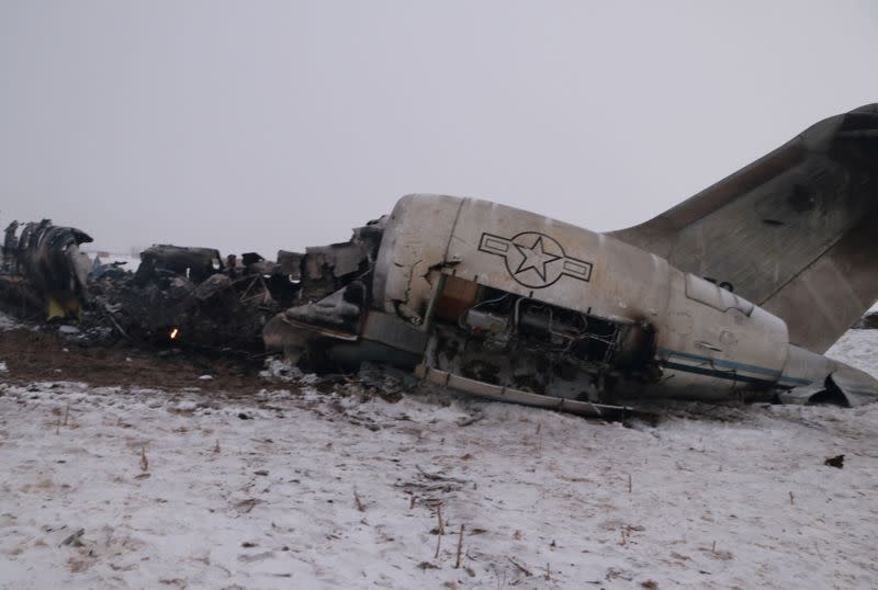 The wreckage of an airplane is seen after a crash in Deh Yak district of Ghazni province, Afghanistan