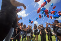 <p>Balloons are released as friends and family attend the burial of Frank Hernandez at Highland Memorial Park in Weslaco, Texas, June 18, 2016. (Joel Martinez/The Monitor via AP) </p>