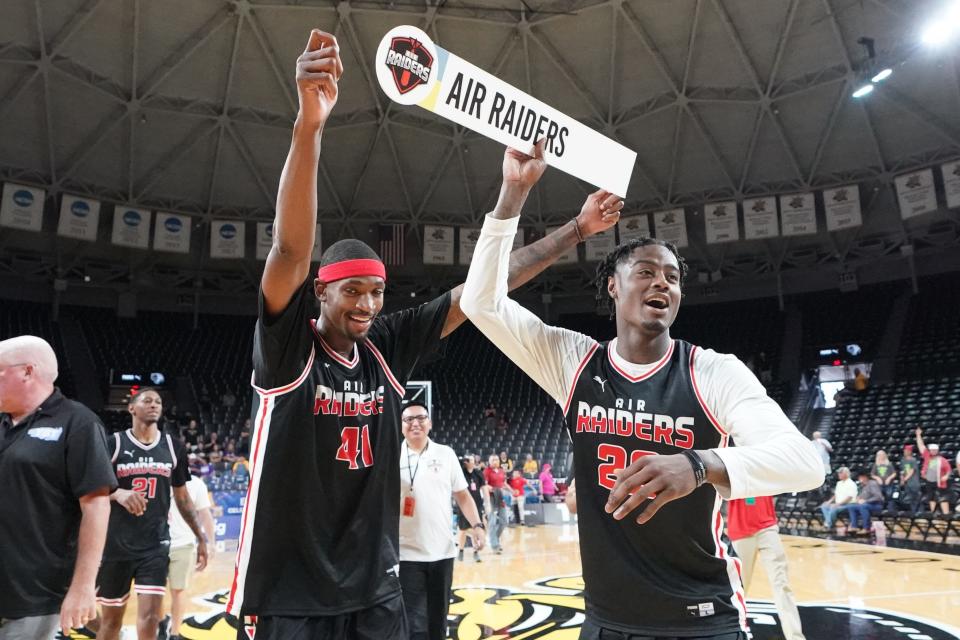 Air Raiders' Tariq Owens, left, and Darrion Warren raise the Air Raider sign at the against the B1 Ballers  during the TBT Tournament, Friday, July 22, 2022, in Wichita, Kansas.