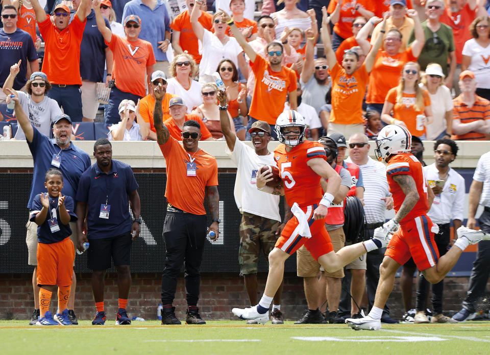 Virginia's quarterback Brennan Armstrong(5) runs the ball for a touchdown against Richmond during the first half of the NCAA college football game at University of Virginia in Charlottesville, Va., on Saturday, Sept. 3, 2022. (Daniel Sangjib Min/Richmond Times-Dispatch via AP)