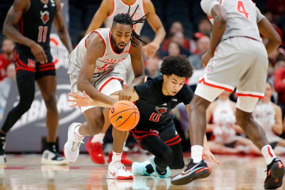 Jan 3, 2024; Columbus, Ohio, USA; Ohio State Buckeyes guard Evan Mahaffey (12) and Rutgers Scarlet Knights guard Derek Simpson (0) go for the loose ball during the first half at Value City Arena. Mandatory Credit: Joseph Maiorana-USA TODAY Sports