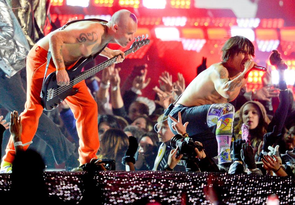 Bruno Mars performs with the Red Hot Chili Peppers in the Superbowl Halftime Show during Super Bowl XLVIII