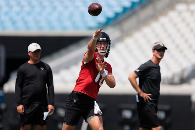 Jacksonville Jaguars quarterback Trevor Lawrence (16) looks for a