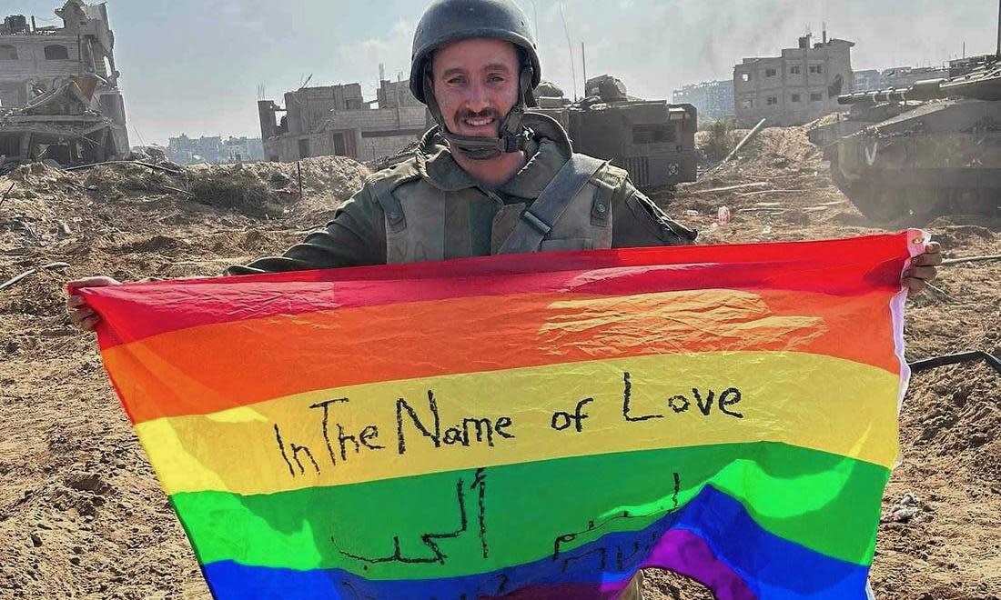 <span>One of two images of Israeli soldier Yoav Atzmoni that was posted on Instagram by the Israeli government in November 2023 with the caption: “The first ever pride flag raised in Gaza”.</span><span>Photograph: @stateofisrael/instagram</span>