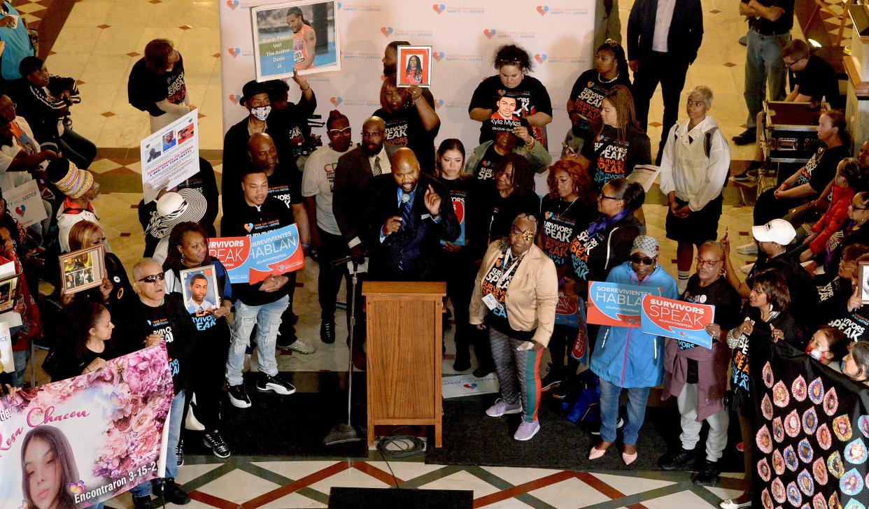 Sen. Elgie Simms Jr., D-Chicago, center, speaks during the Survivors Speak Illinois rally in the state Capitol rotunda Thursday, April 20, 2023.