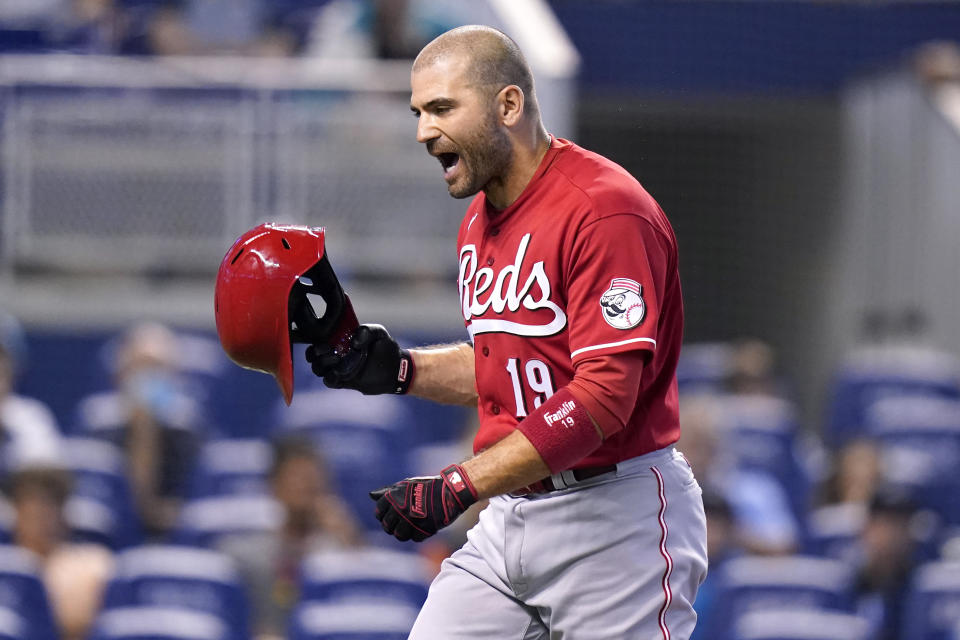 Cincinnati Reds' Joey Votto reacts after striking out during the first inning of a baseball game against the Miami Marlins, Sunday, Aug. 29, 2021, in Miami. (AP Photo/Lynne Sladky)