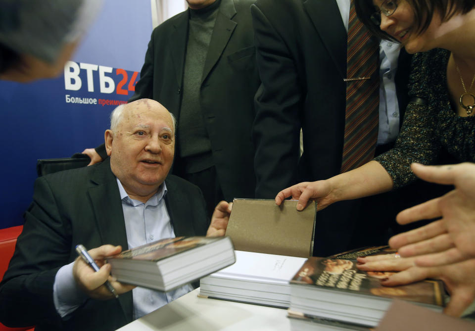 Former Soviet leader Mikhail Gorbachev signs his book in a book shop in Moscow, Russia, Tuesday, Nov. 13, 2012. Mikhail Gorbachev looks back at his life in his new book Alone with Myself. He talks about his young years with a remarkable candor in the book, which is full of love for his late wife. (AP Photo/Misha Japaridze)