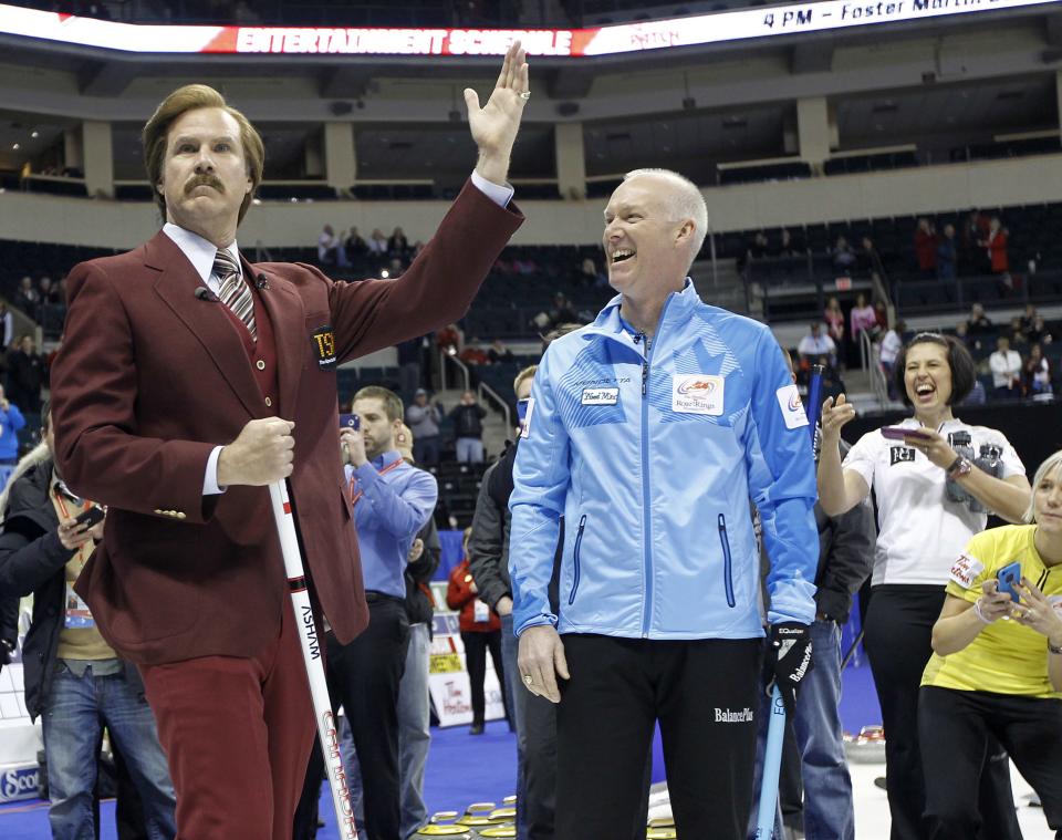 Will Ferrell (L) as Ron Burgundy jokes with Skip Glenn Howard prior to the start of the Roar of the Rings Canadian Olympic Curling Trials in Winnipeg, Manitoba December 1, 2013. REUTERS/Trevor Hagan (CANADA - Tags: SPORT ENTERTAINMENT CURLING)
