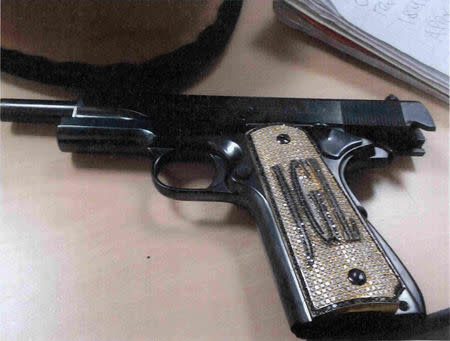 A diamond-encrusted pistol that government witness Jesus Zambada said belonged to the accused Mexican drug lord Joaquin "El Chapo" Guzman, is shown in this government evidence photo at his trial for drug smuggling, in Brooklyn federal court in New York, U.S., November 19, 2018. Courtesy U.S. Department of Justice (DOJ)/Handout via REUTERS