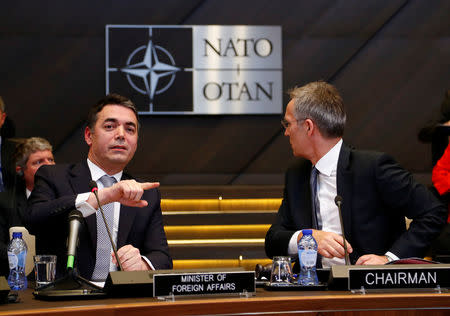 Macedonian Foreign Minister Nikola Dimitrov and NATO Secretary General Jens Stoltenberg attend a signature ceremony of the accession protocol between the Republic of North Macedonia and NATO at the Alliance headquarters in Brussels, Belgium February 6, 2019. REUTERS/Francois Lenoir/Pool