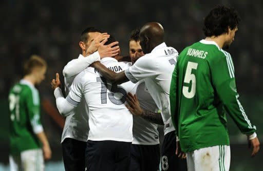 French midfielder Florent Malouda (C) celebrates scoring with his teammates during the International friendly football match Germany vs France in the northern German city of Bremen in preperation for the UEFA Euro 2012