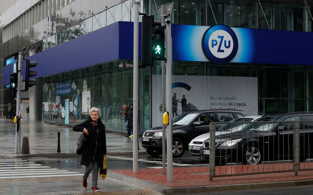 Woman walks outside PZU's headquarters in Warsaw, Poland September 20, 2017. REUTERS/Kacper Pempel