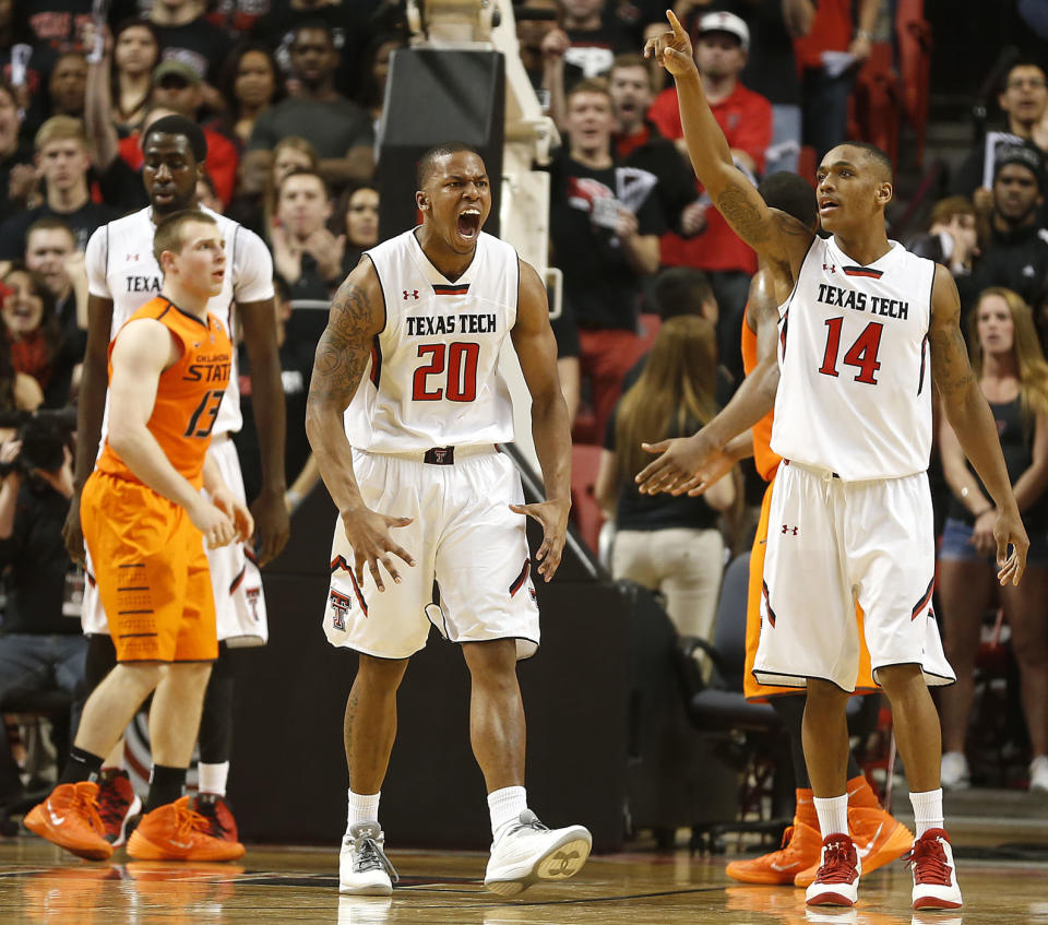 Texas Tech's Toddrick Gotcher(20) and Robert Turner(14) celebrate after scoring against Oklahoma State during their NCAA college basketball game in Lubbock, Texas, Saturday, Feb, 8, 2014. (AP Photo/Lubbock Avalanche-Journal, Tori Eichberger) ALL LOCAL TV OUT