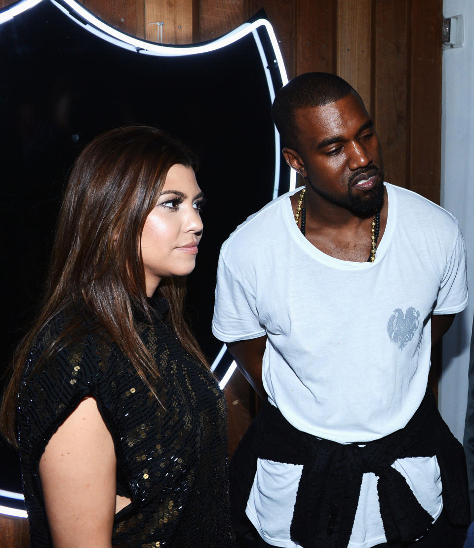 MIAMI BEACH, FL - DECEMBER 06: Kourtney Kardashian and Kanye West attend the celebration of Dom Perignon Luminous Rose at Wall at W Hotel on December 6, 2012 in Miami Beach, Florida. (Photo by Dimitrios Kambouris/Getty Images for Dom Perignon)