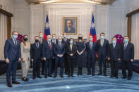 In this photo released by the Taiwan Presidential Office, Taiwanese President Tsai Ing-wen, center, poses for photos with a delegation from the Baltic States at the Presidential Office in Taipei, Taiwan on Monday, Nov. 29, 2021. Lawmakers from all three Baltic states met with Tsai on Monday in a sign of further cooperation between European Union nations and Taiwan. (Taiwan Presidential Office via AP)