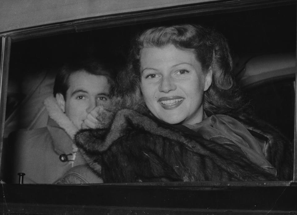 Now Princess Ali Khan, the U.S. American actress Rita Hayworth, goes for a car ride with her brother in law, Prince Saruddin in Lausanne, Switzerland, November 10, 1949.  (AP Photo/Nash)