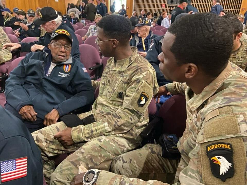 World War II veteran Richard Stewart talks with soldiers during his trip back to Normandy, France, to mark the 79th anniversary of D-Day in 2023.