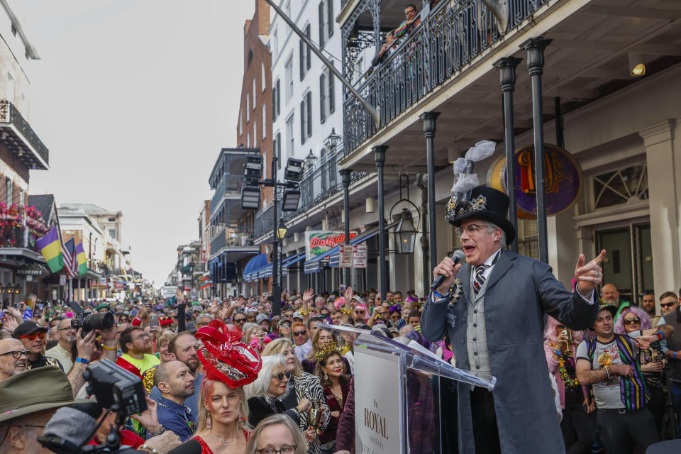 Bryan Batt emcees during the 54th annual Greasing of the Poles at the Royal Sonesta Hotel in New Orleans, Friday, Feb. 9, 2024. Carnival season 2024 is entering its final days in New Orleans with big parades on the city's main thoroughfares and smaller, offbeat walking clubs strolling the old French Quarter. (Sophia Germe/The Times-Picayune/The New Orleans Advocate via AP)