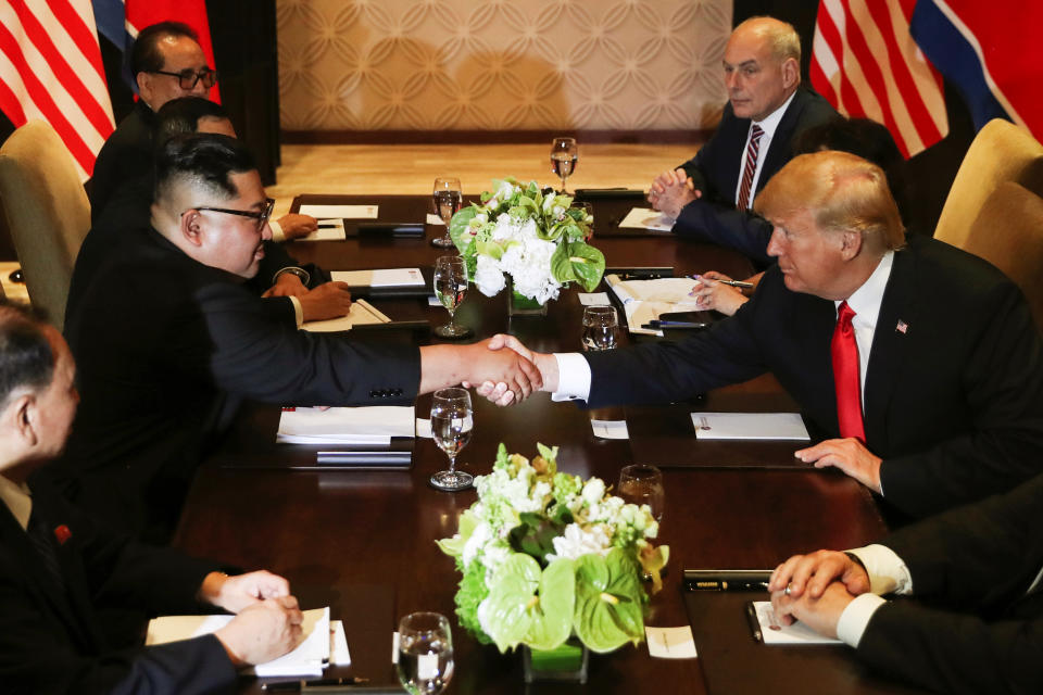 <p>President Donald Trump shakes hands with North Korea’s leader Kim Jong Un before their expanded bilateral meeting at the Capella Hotel on Sentosa island in Singapore June 12, 2018. (Photo: Jonathan Ernst/Reuters) </p>