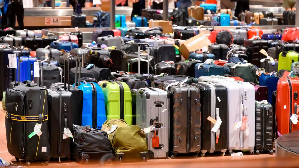 Suitcases can really pile up in a baggage claim area, such as this one in Hamburg, Germany. If your luggage is lost, you can get compensation. - Jonas Walzberg/picture-alliance/dpa/AP