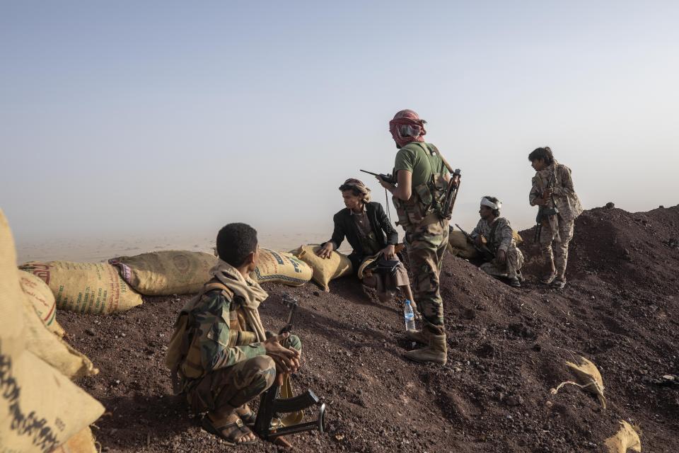 Yemeni fighters backed by the Saudi-led coalition on the Kassara frontline near Marib, Yemen, Sunday, June 20, 2021. (AP Photo/Nariman El-Mofty)