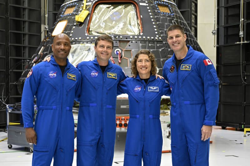 Left to right, NASA's Artemis II crew, pilot Victor Glover, commander Reid Wiseman, mission specialist Christina Koch and mission specialist Jeremy Hansen from Canada pose in front of the Orion spacecraft as it is being prepared at Kennedy Space Center in Florida for their mission planned for late 2024. Photo by Joe Marino/UPI